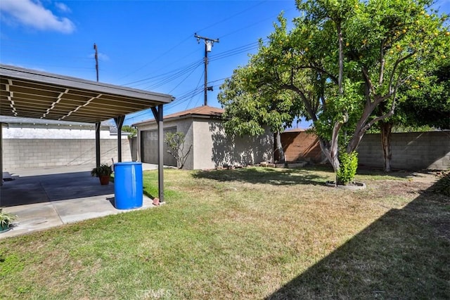 view of yard featuring a patio and an outdoor structure