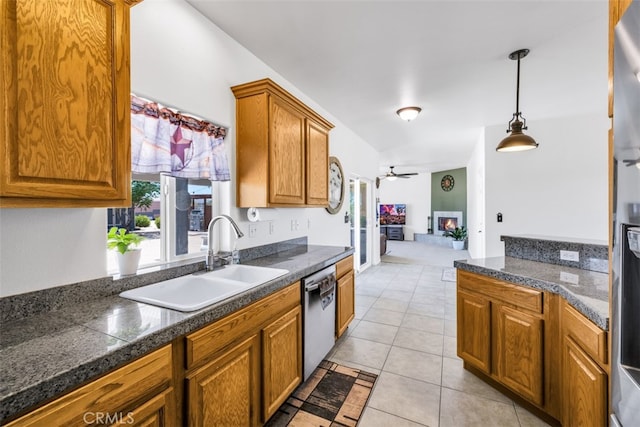 60849 Duvall Dr, Joshua Tree, CA 92252 - kitchen featuring stainless steel dishwasher, a sink, ceiling fan, tile counters, and brown cabinetry