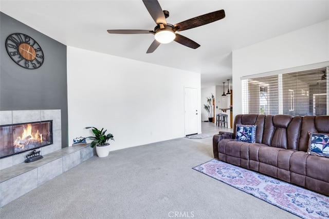 60849 Duvall Dr, Joshua Tree, CA 92252 - living area with carpet floors, a ceiling fan, and a tiled fireplace
