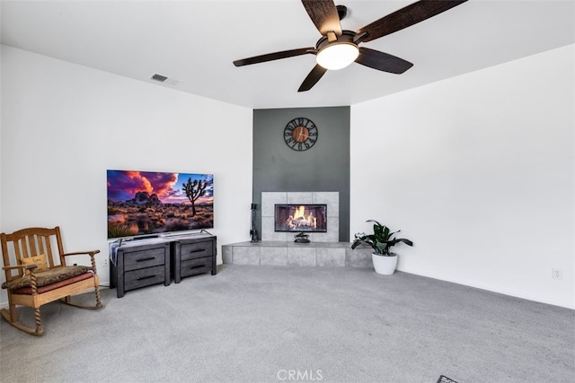 60849 Duvall Dr, Joshua Tree, CA 92252 - carpeted living room with a fireplace and ceiling fan