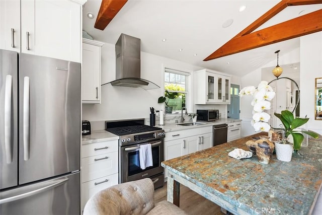 385 Mermaid, Laguna Beach, CA 92651 - kitchen featuring stainless steel appliances, wall chimney range hood, a sink, white cabinetry, and recessed lighting