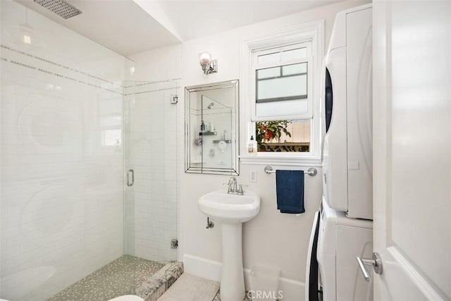 385 Mermaid, Laguna Beach, CA 92651 - full bath with stacked washer and clothes dryer, a shower stall, and a sink