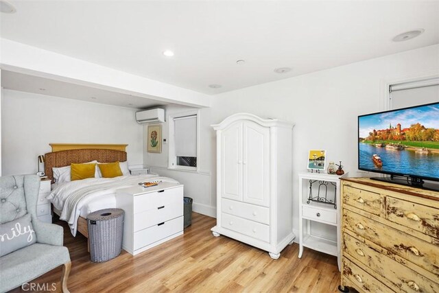 385 Mermaid, Laguna Beach, CA 92651 - bedroom featuring light wood-type flooring, a wall mounted AC, and recessed lighting