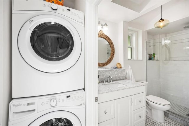 385 Mermaid, Laguna Beach, CA 92651 - full bathroom featuring stacked washer / drying machine, a shower stall, toilet, and tasteful backsplash