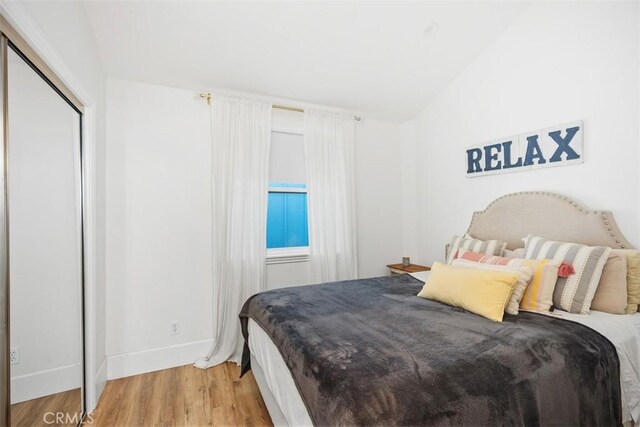 385 Mermaid, Laguna Beach, CA 92651 - bedroom with light wood finished floors, baseboards, and a closet