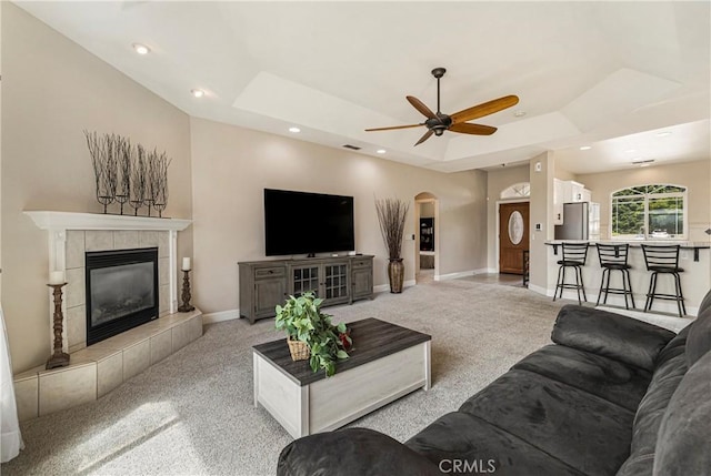 6 Vintage Ct, Chico, CA 95973 - living area with a raised ceiling, light carpet, a ceiling fan, a fireplace, and recessed lighting