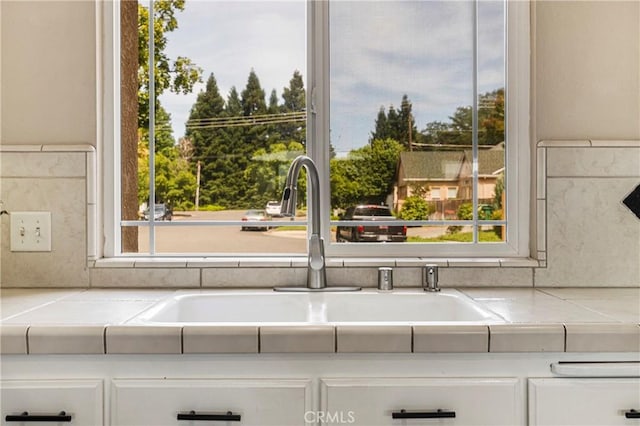6 Vintage Ct, Chico, CA 95973 - kitchen view of a sink, white cabinets, and tile countertops