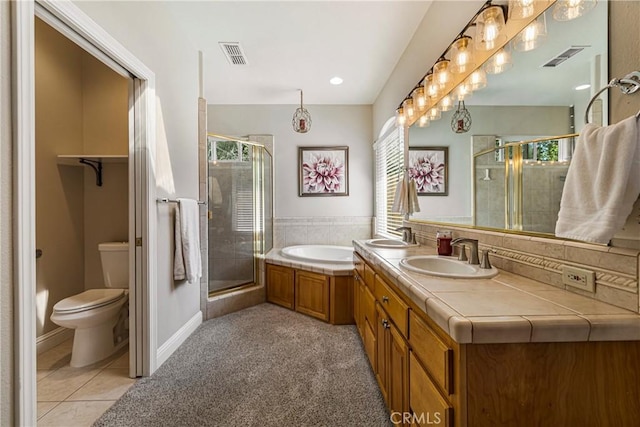 6 Vintage Ct, Chico, CA 95973 - full bathroom featuring a stall shower, toilet, a bath, double vanity, and tile patterned flooring