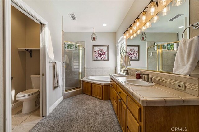 6 Vintage Ct, Chico, CA 95973 - full bath featuring a shower stall, a bath, double vanity, and tile patterned floors