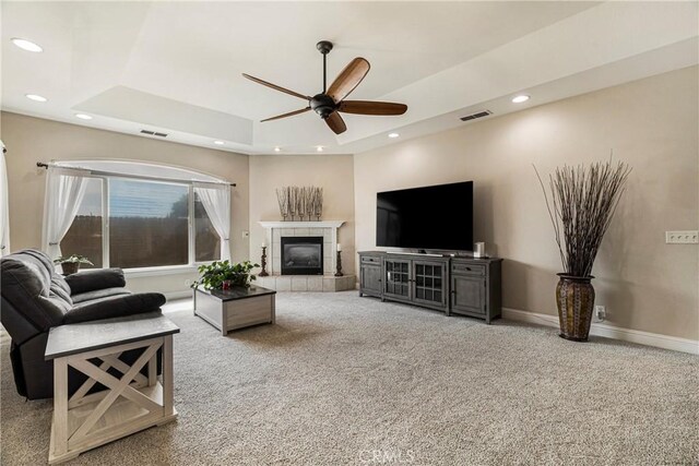6 Vintage Ct, Chico, CA 95973 - living area featuring a tray ceiling, a ceiling fan, carpet, recessed lighting, and a tile fireplace