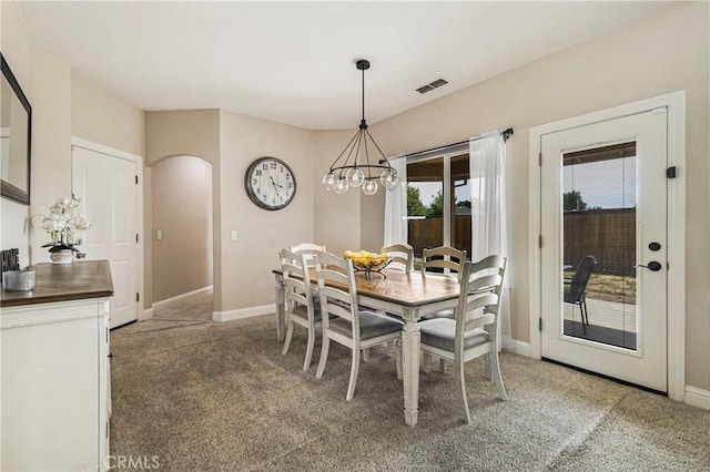 6 Vintage Ct, Chico, CA 95973 - dining area with arched walkways, light colored carpet, and a chandelier