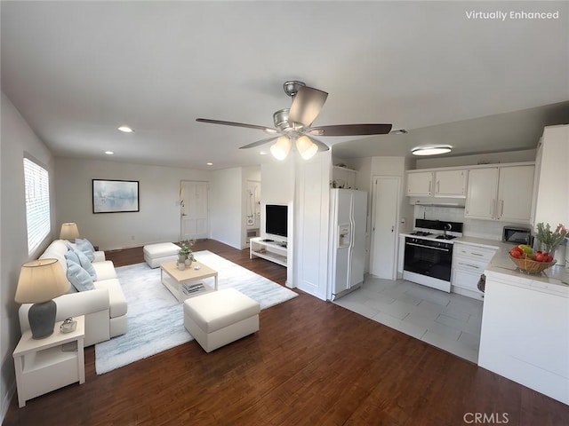 18619 Collins St Unit F29, Tarzana, CA 91356 - living room featuring ceiling fan, recessed lighting, and light wood finished floors
