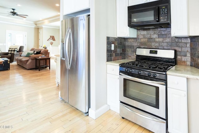 385 Spruce Dr, Lake Arrowhead, CA 92352 - kitchen featuring stainless steel appliances, open floor plan, white cabinets, crown molding, and light wood-style flooring