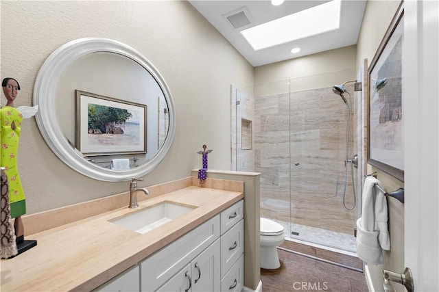 65 Centre Ct, Dana Point, CA 92629 - full bath with toilet, a stall shower, vanity, recessed lighting, and a skylight