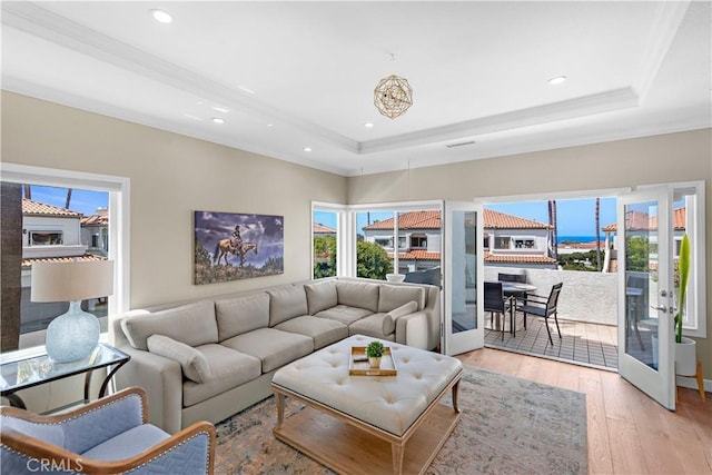 65 Centre Ct, Dana Point, CA 92629 - living area with a raised ceiling, plenty of natural light, crown molding, light wood finished floors, and recessed lighting