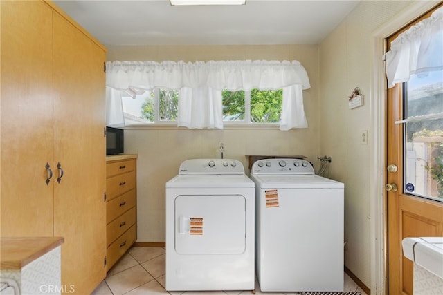 16520 Simonds St, Granada Hills, CA 91344 - laundry area featuring washer and dryer and light tile patterned floors