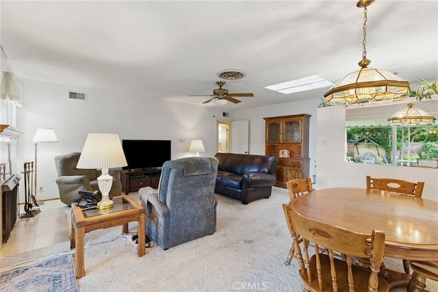 16520 Simonds St, Granada Hills, CA 91344 - living area with ceiling fan, light carpet, and a skylight