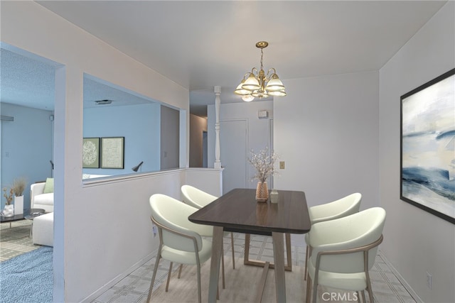 1012 W Lime Ave, Lompoc, CA 93436 - dining room featuring a chandelier and baseboards