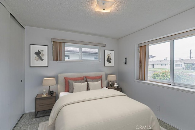 1012 W Lime Ave, Lompoc, CA 93436 - bedroom with baseboards, a textured ceiling, and a closet