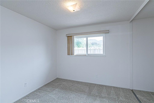 1012 W Lime Ave, Lompoc, CA 93436 - carpeted spare room with a textured ceiling and baseboards