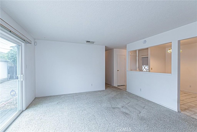 1012 W Lime Ave, Lompoc, CA 93436 - empty room with light colored carpet and a textured ceiling