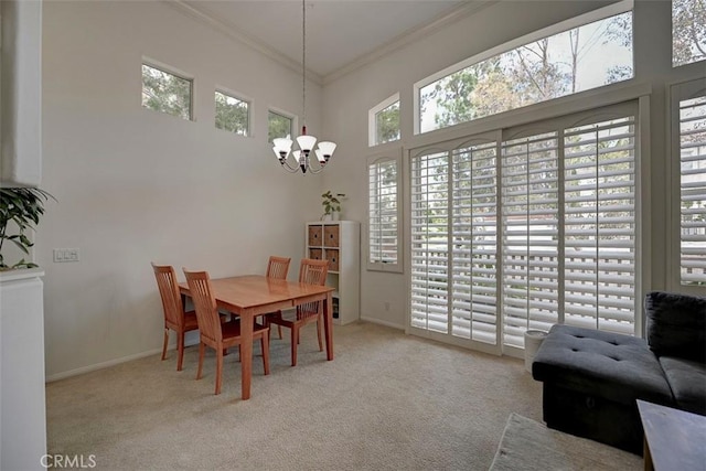 2643 Dietrich Dr, Tustin, CA 92782 - dining space featuring a chandelier, carpet flooring, crown molding, baseboards, and a towering ceiling