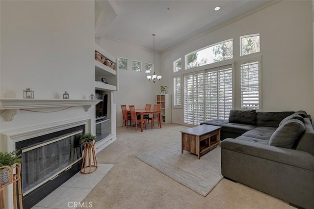 2643 Dietrich Dr, Tustin, CA 92782 - carpeted living room featuring a chandelier, a fireplace with flush hearth, a towering ceiling, and ornamental molding
