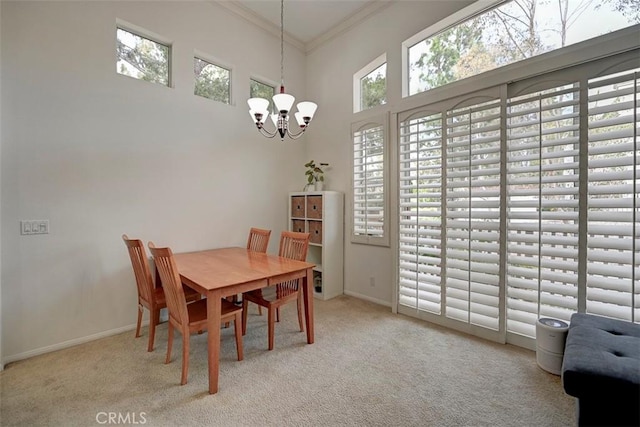 2643 Dietrich Dr, Tustin, CA 92782 - carpeted dining area featuring a chandelier, ornamental molding, baseboards, and a high ceiling