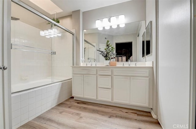 2643 Dietrich Dr, Tustin, CA 92782 - full bath featuring double vanity, wood finished floors, and tiled shower / bath