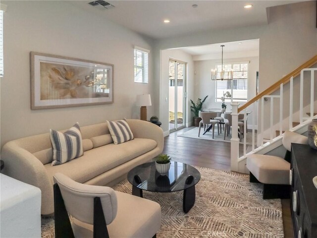 619 E Walnut, Monrovia, CA 91016 - living area featuring a chandelier, wood finished floors, stairs, healthy amount of natural light, and recessed lighting