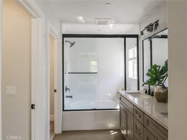 619 E Walnut, Monrovia, CA 91016 - full bathroom featuring bath / shower combo with glass door, double vanity, and wood finished floors