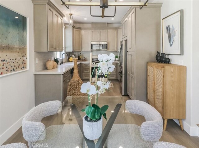 619 E Walnut, Monrovia, CA 91016 - kitchen featuring stainless steel appliances, wood finished floors, light countertops, baseboards, and recessed lighting