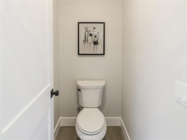 619 E Walnut, Monrovia, CA 91016 - bathroom featuring baseboards, wood finished floors, and toilet