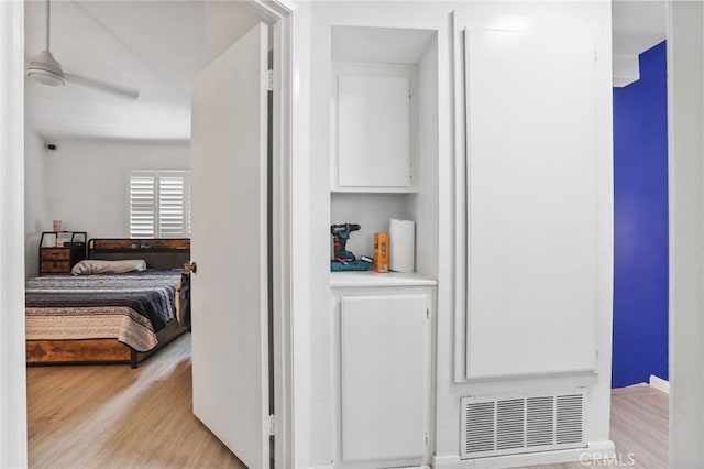 21814 Belshire Ave Unit 2, Hawaiian Gardens, CA 90716 - hallway featuring light wood-style flooring