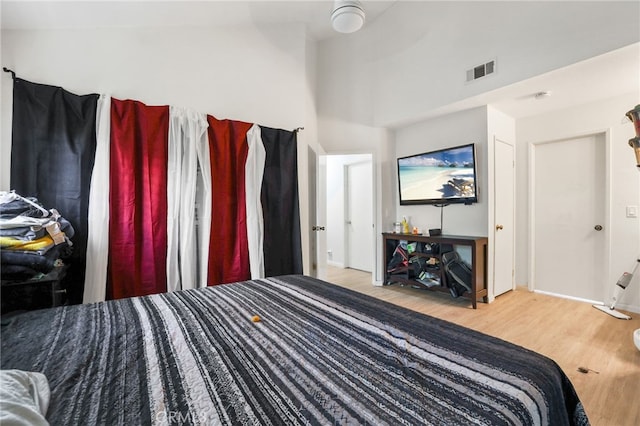 21814 Belshire Ave Unit 2, Hawaiian Gardens, CA 90716 - bedroom with wood finished floors, a high ceiling, and baseboards