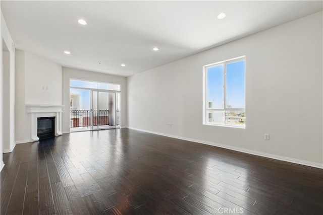 3750 Santa Rosalia Dr Unit 614, Los Angeles, CA 90008 - unfurnished living room featuring healthy amount of natural light, dark wood finished floors, baseboards, and recessed lighting