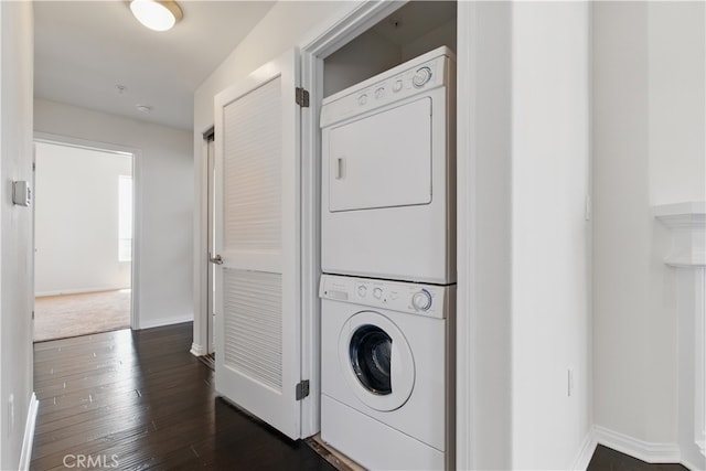 3750 Santa Rosalia Dr Unit 614, Los Angeles, CA 90008 - laundry area with stacked washing machine and dryer, baseboards, and dark wood-style floors