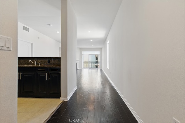 3750 Santa Rosalia Dr Unit 614, Los Angeles, CA 90008 - corridor with wood finished floors, baseboards, and a sink