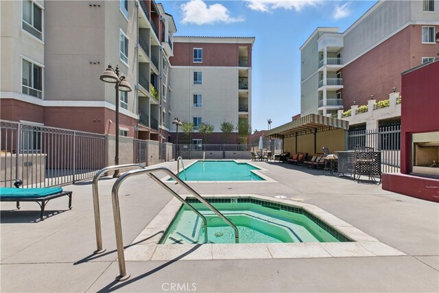 3750 Santa Rosalia Dr Unit 614, Los Angeles, CA 90008 - community pool with a hot tub and a patio