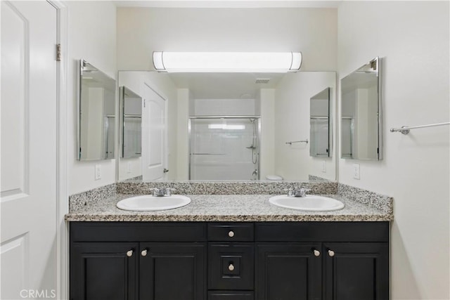 3750 Santa Rosalia Dr Unit 614, Los Angeles, CA 90008 - bathroom with a shower with shower door and double vanity