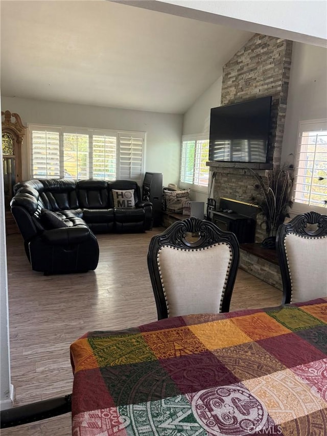 8904 Nelson Way, Escondido, CA 92026 - living area featuring wood finished floors, vaulted ceiling, and a fireplace