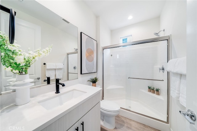 196 Episode, Irvine, CA 92618 - bathroom with a shower stall, vanity, toilet, and wood finished floors