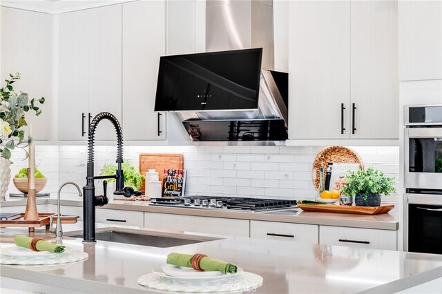 196 Episode, Irvine, CA 92618 - kitchen with white cabinets, a sink, light countertops, and decorative backsplash