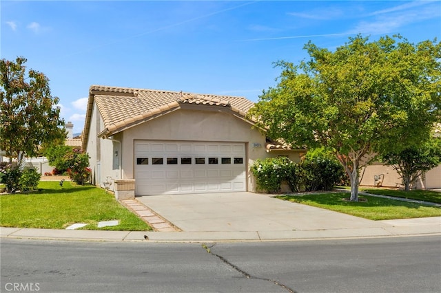6249 Firestone Cir, Banning, CA 92220 - view of front of home featuring an attached garage, concrete driveway, a front yard, and stucco siding