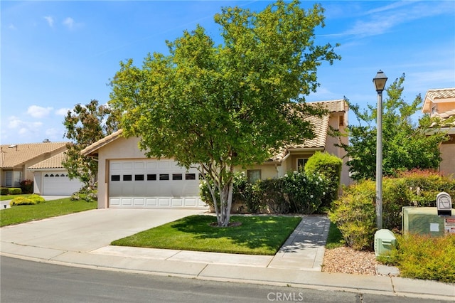 6249 Firestone Cir, Banning, CA 92220 - view of property hidden behind natural elements with stucco siding, driveway, a garage, and a tiled roof