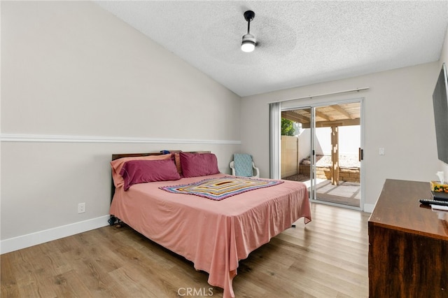6249 Firestone Cir, Banning, CA 92220 - bedroom featuring access to outside, light wood finished floors, vaulted ceiling, a textured ceiling, and baseboards