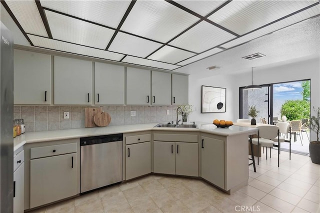 4424 Park Jazmin, Calabasas, CA 91302 - kitchen featuring a sink, dishwasher, a peninsula, backsplash, and light countertops