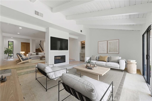 4424 Park Jazmin, Calabasas, CA 91302 - living room with light carpet, a glass covered fireplace, stairway, and recessed lighting