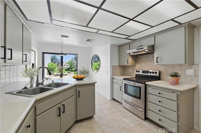 4424 Park Jazmin, Calabasas, CA 91302 - kitchen with electric range, under cabinet range hood, a sink, and tasteful backsplash