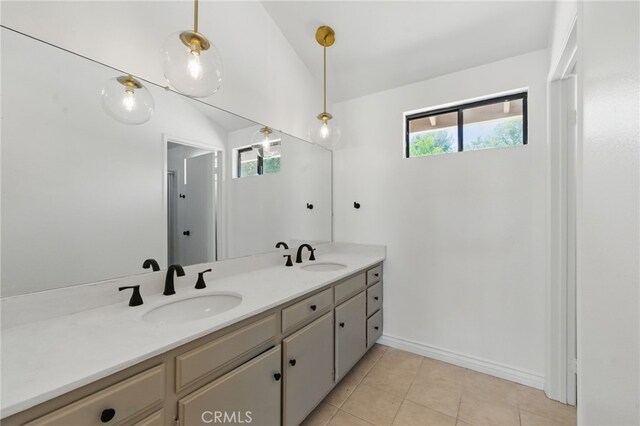 4424 Park Jazmin, Calabasas, CA 91302 - bathroom with double vanity, lofted ceiling, tile patterned floors, and baseboards